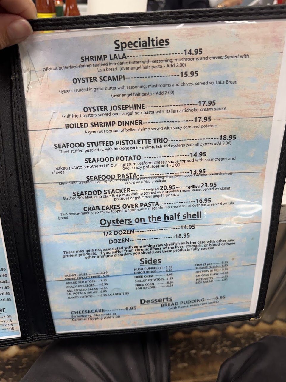 Restaurant menu page with seafood selections.